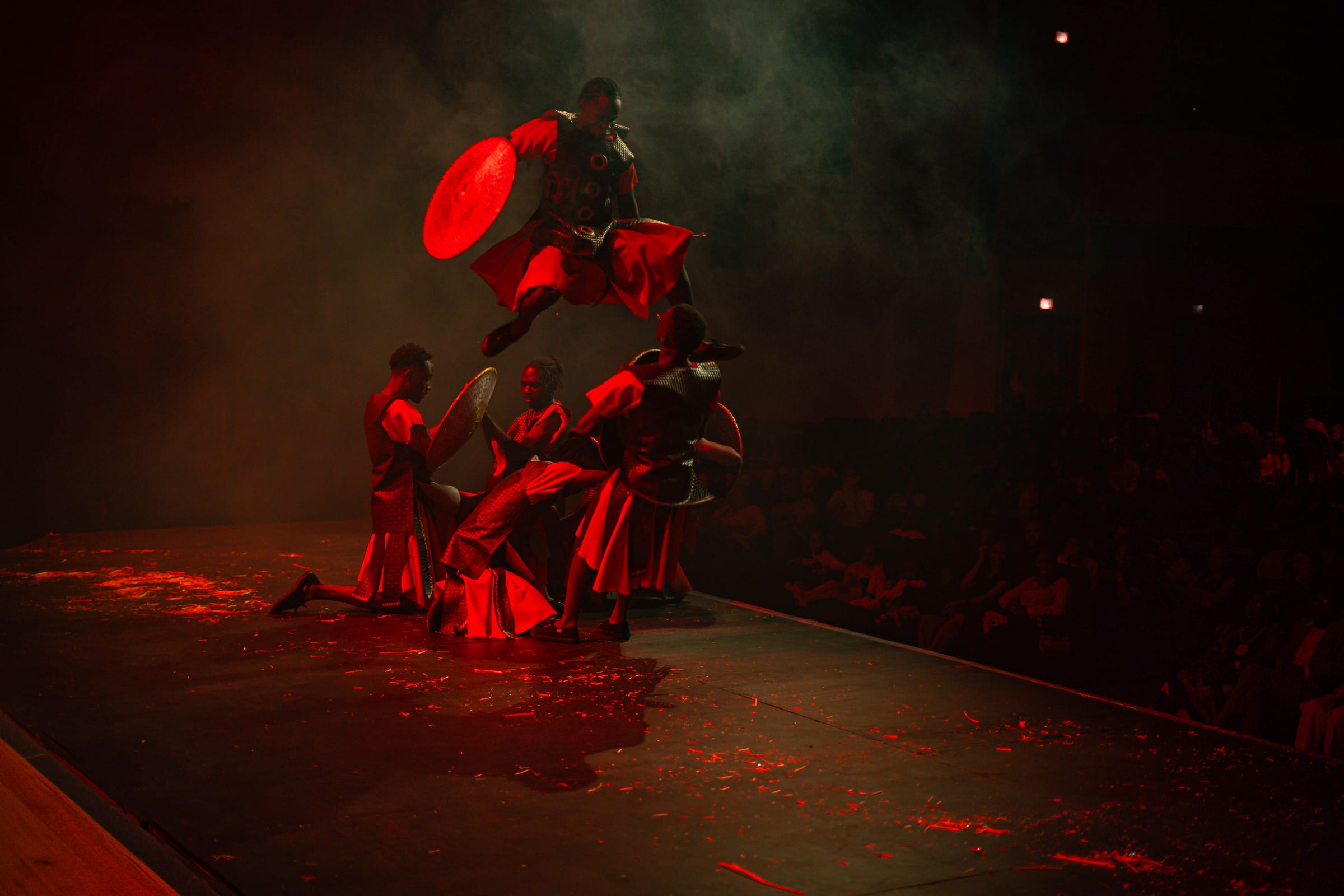 A Salt and Light Chronicles dancer airborne mid-leap with a shield during In Search of the King